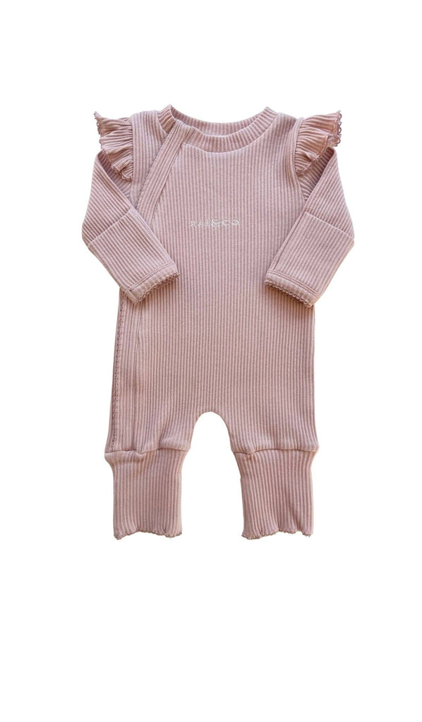 Pink ribbed baby romper with ruffled sleeves on a white background