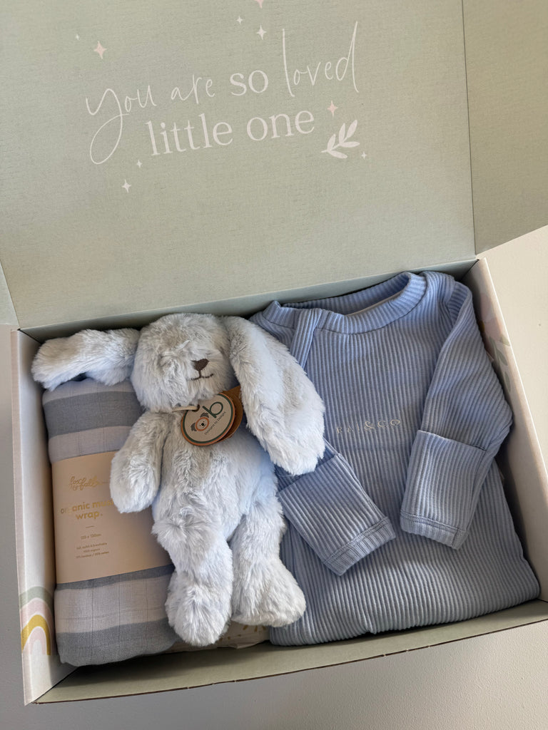 Baby gift set with plush toy, baby blanket, and outfit in a box with 'you are so loved little one' text.